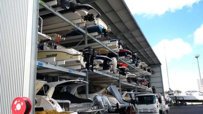 Boat storage shed full of motor boats