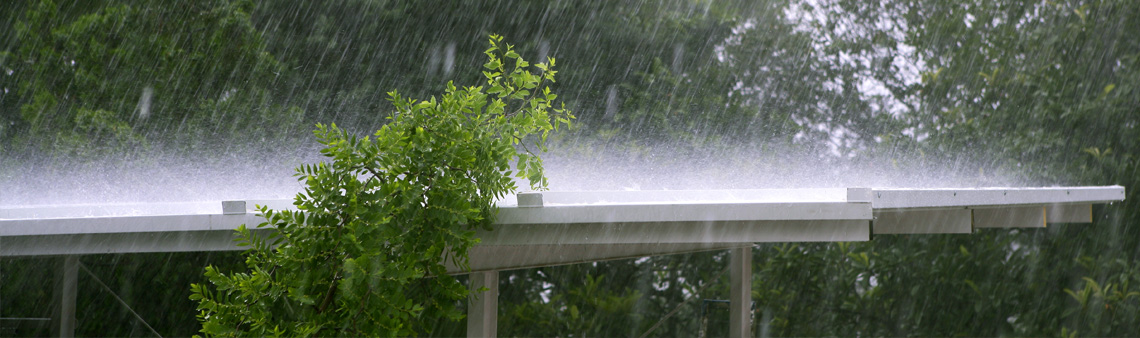Rain falling on covered pedestrian walkway